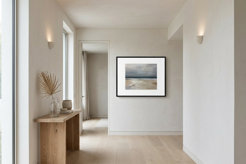 Modern interior with a wooden side table and framed artwork on a white wall.